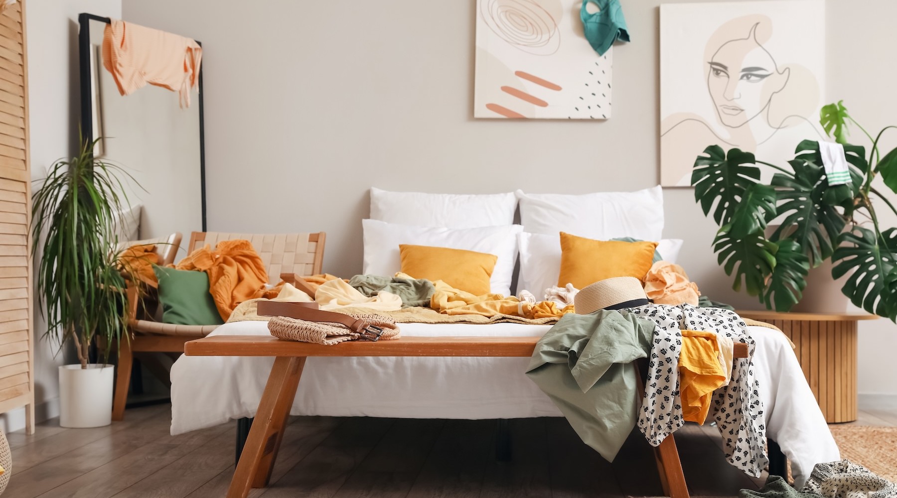 a living room with a couch, coffee table and plants