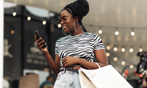 Close to the center of everything a woman holding a phone