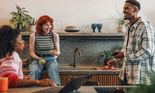 Experience a fresh perspective friends talking in a bright kitchen